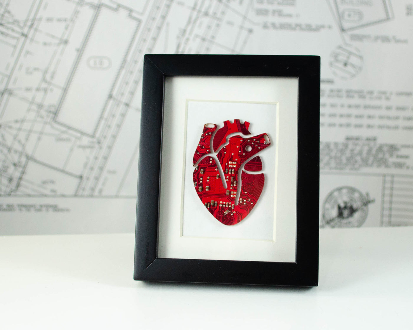 mini framed art of an anatomical heard made from recycled red circuit board