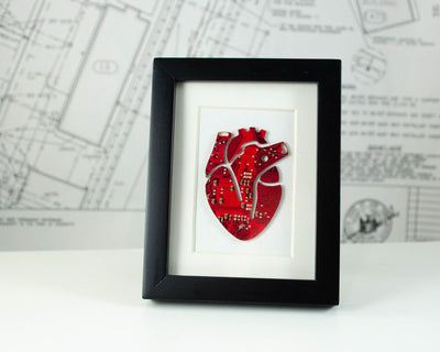 mini framed art of an anatomical heard made from recycled red circuit board