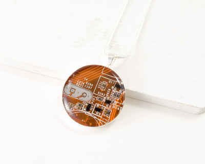 orange circuit board necklace