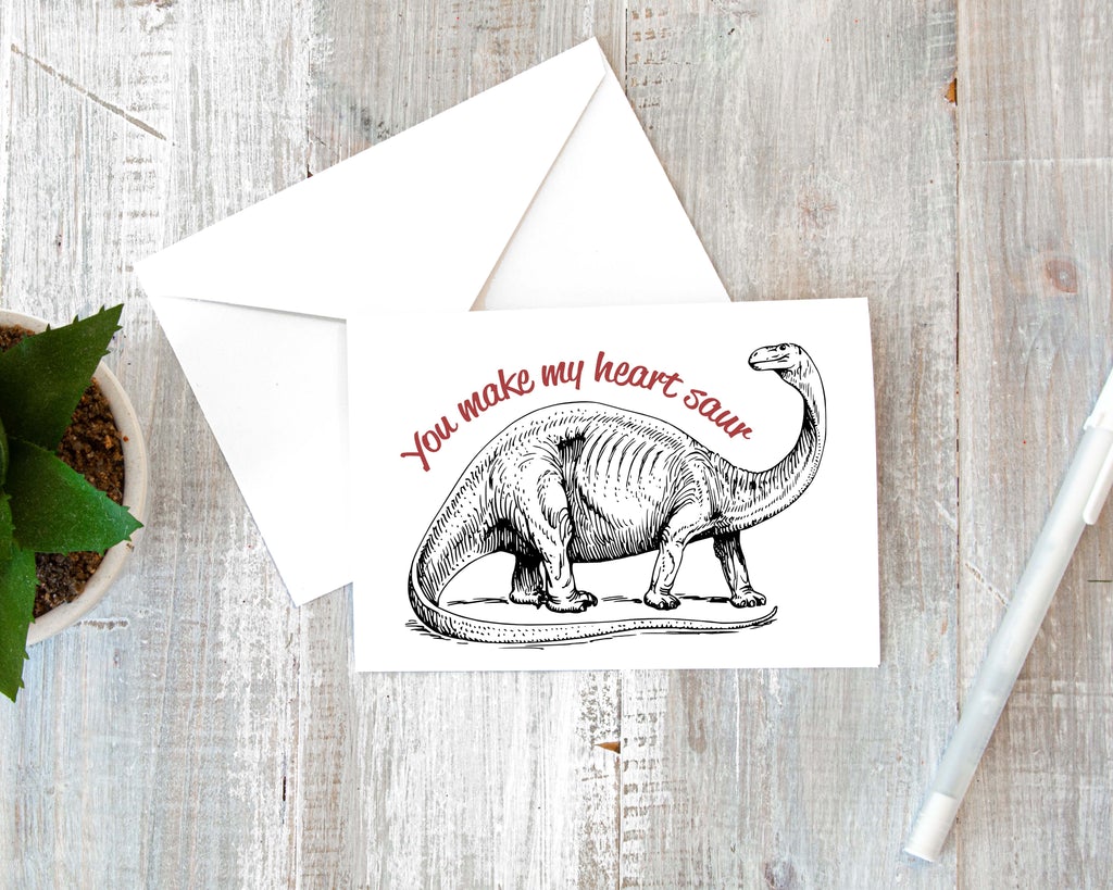 dinosaur valentines day greeting card that says you make my heart saur