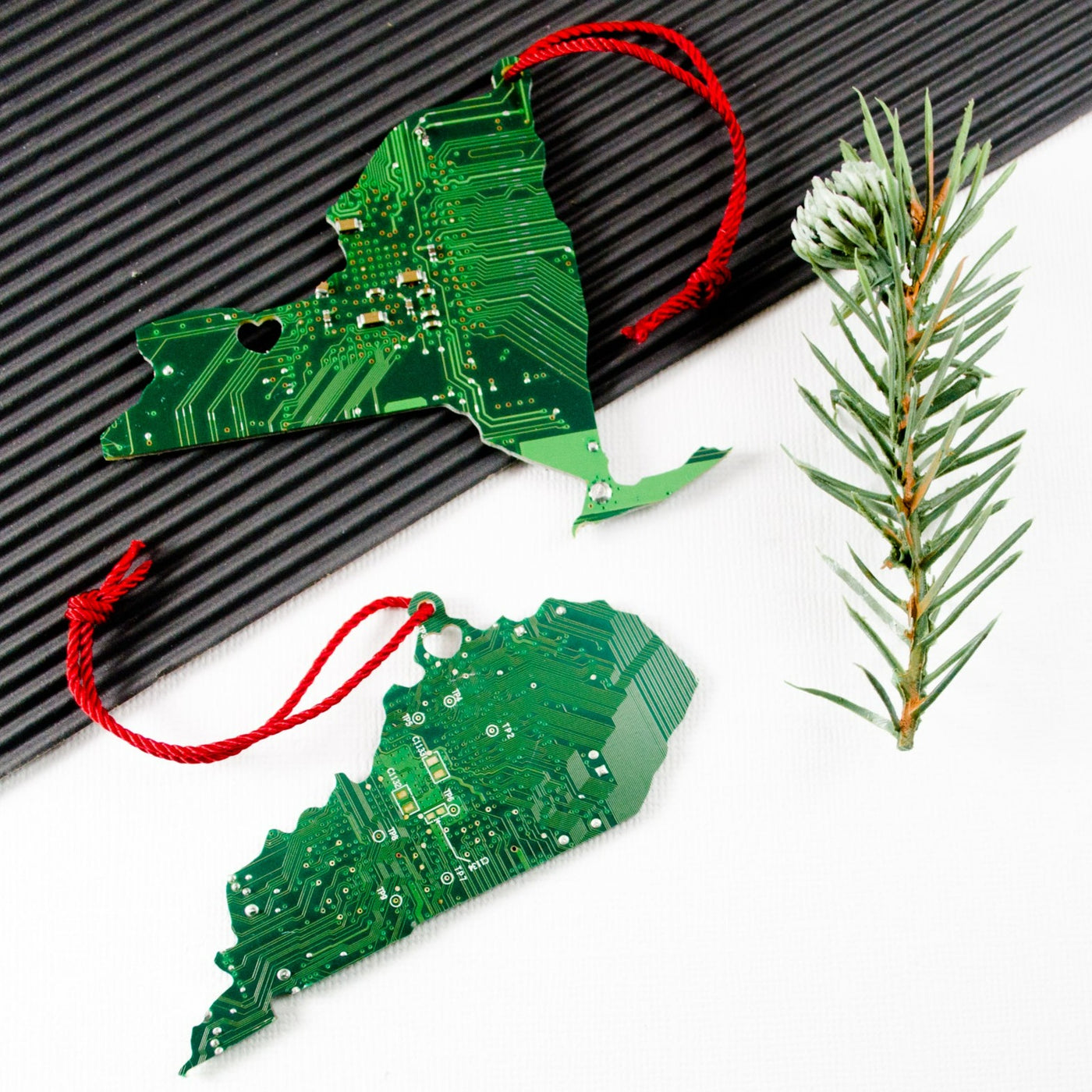 new york and kentucky state ornaments made from recycled green circuit board