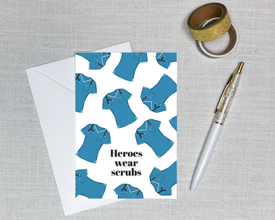 this nursing card shows a pattern of blue scrubs and has text that says heroes wear scrubs