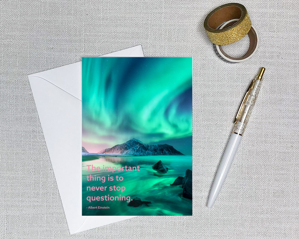 this space card features a photo of an aurora borealis with a quote that says never stop questioning