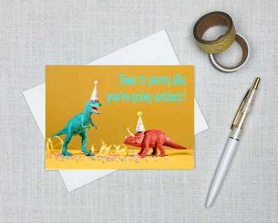 paleontology birthday card with a picture of dinosaurs in party hats that says party like you're going extinct