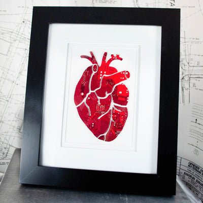 large art piece of anatomical heart made from recycled circuit boards