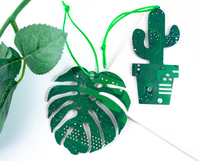 handmade recycled circuit board green ornament in shape of monstera leaf and potted cactus plant