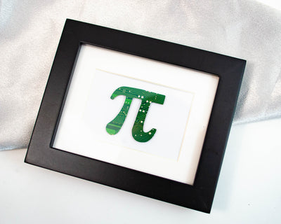 handmade math mini framed art in the shape of pi made from recycled green circuit board and motherboards