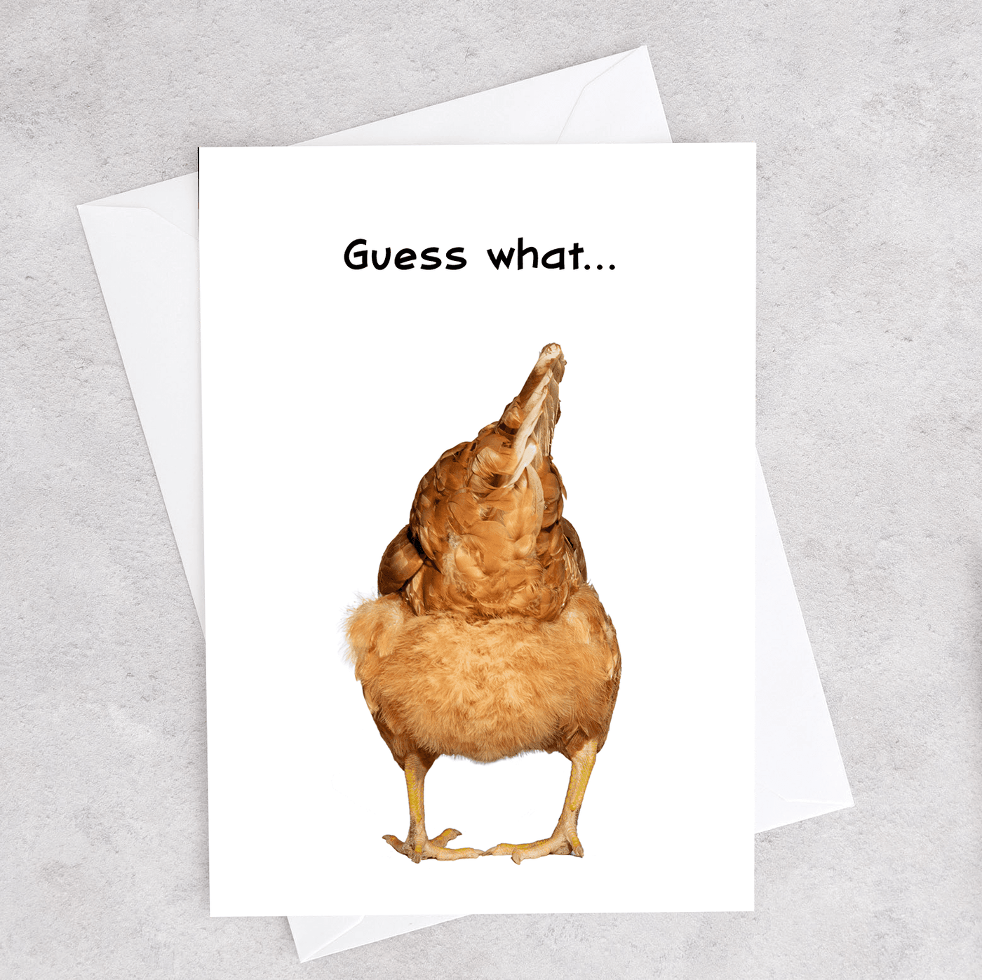 This greeting card show the back / butt of a chicken and says "Guess What?"