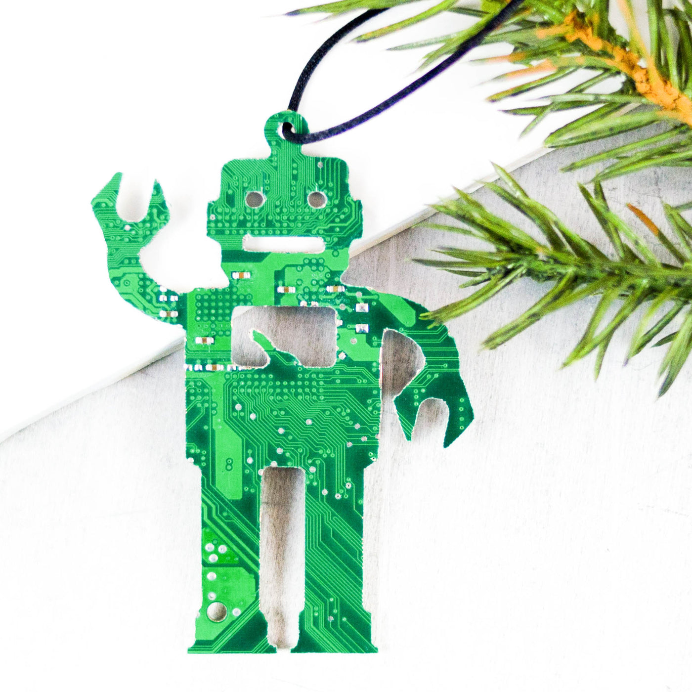 robot shape ornament cut from green recycled computer motherboard