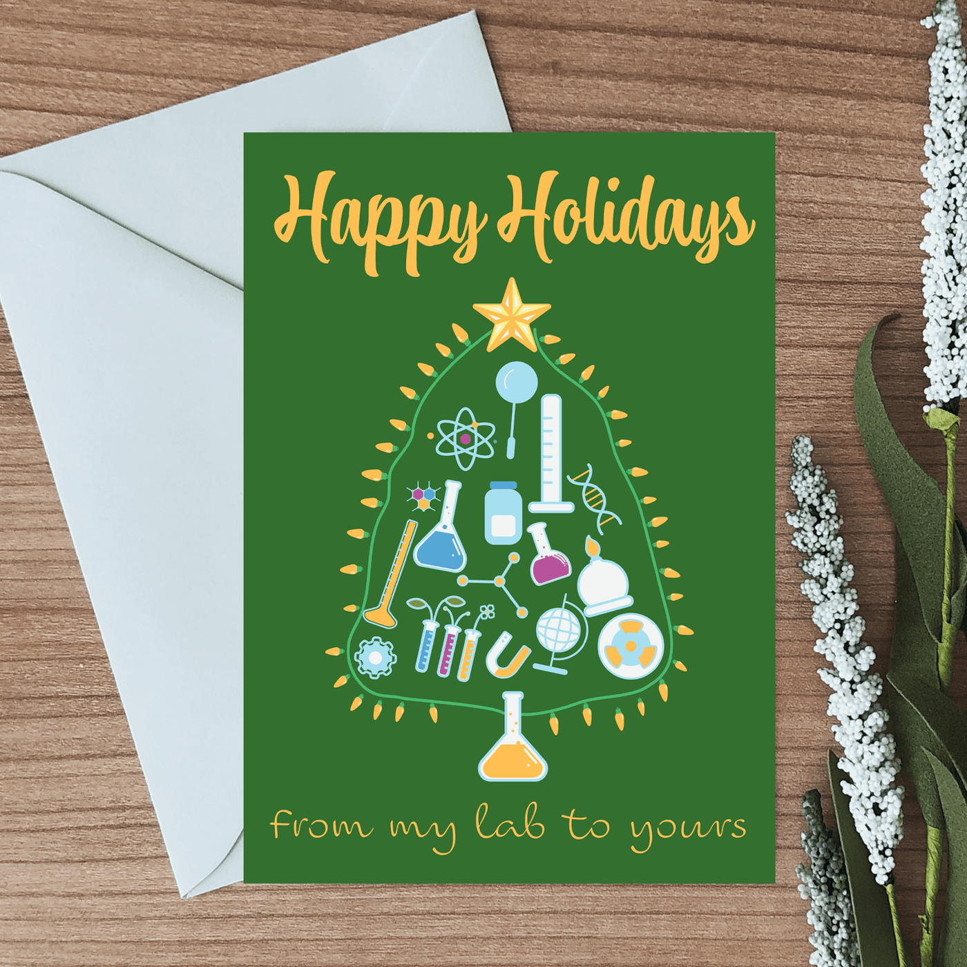 blank inside greeting card with a picture of a holiday tree made of lab equipment and a message wishing them a happy holidays from my lab to yours