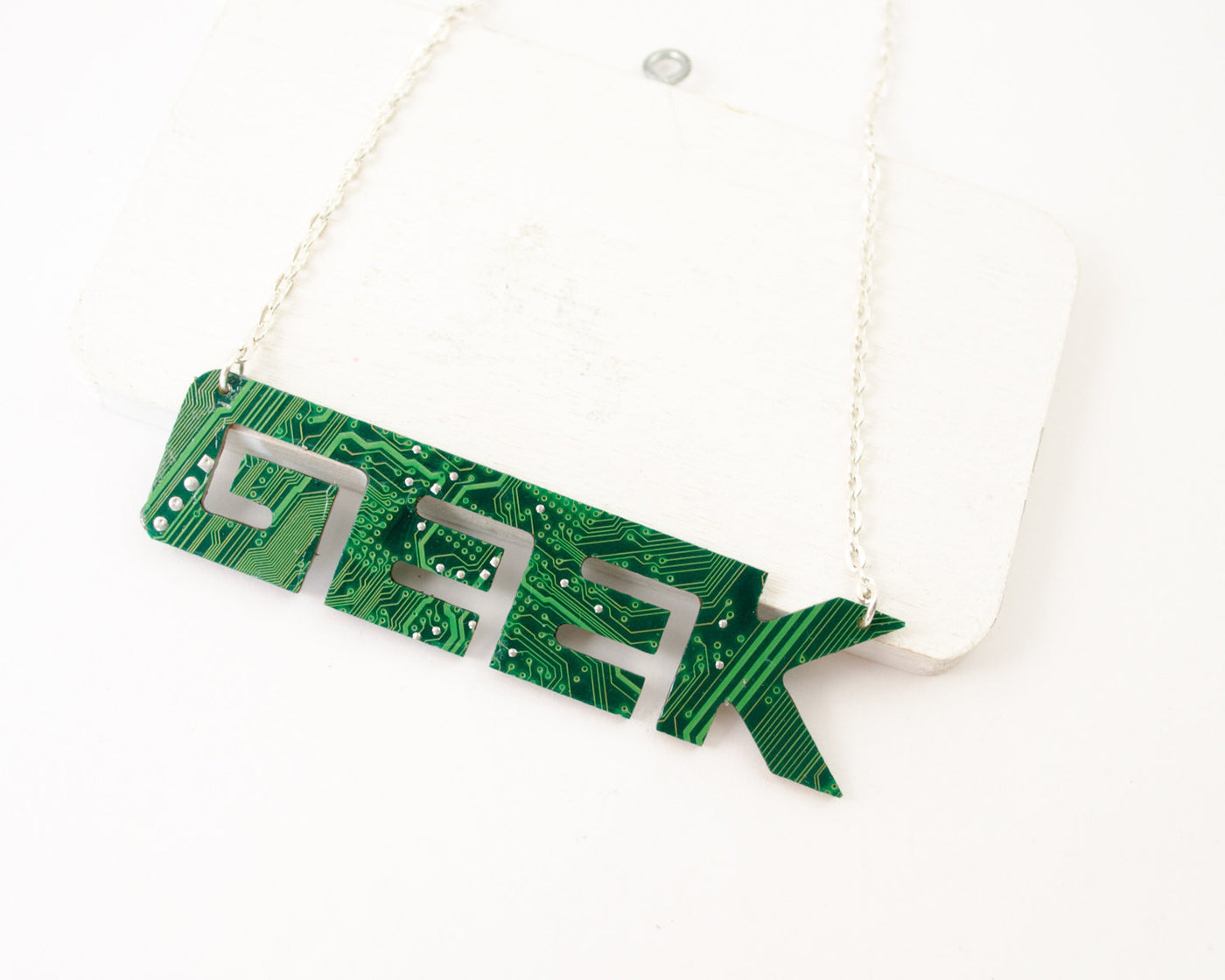 geek word necklace in circuit board