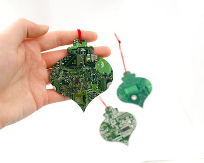 hand holding circuit board ornament