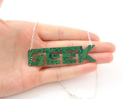 hand holding geek circuit board word necklace