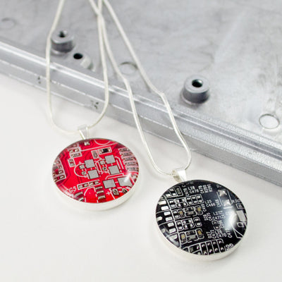red and black circuit board necklaces