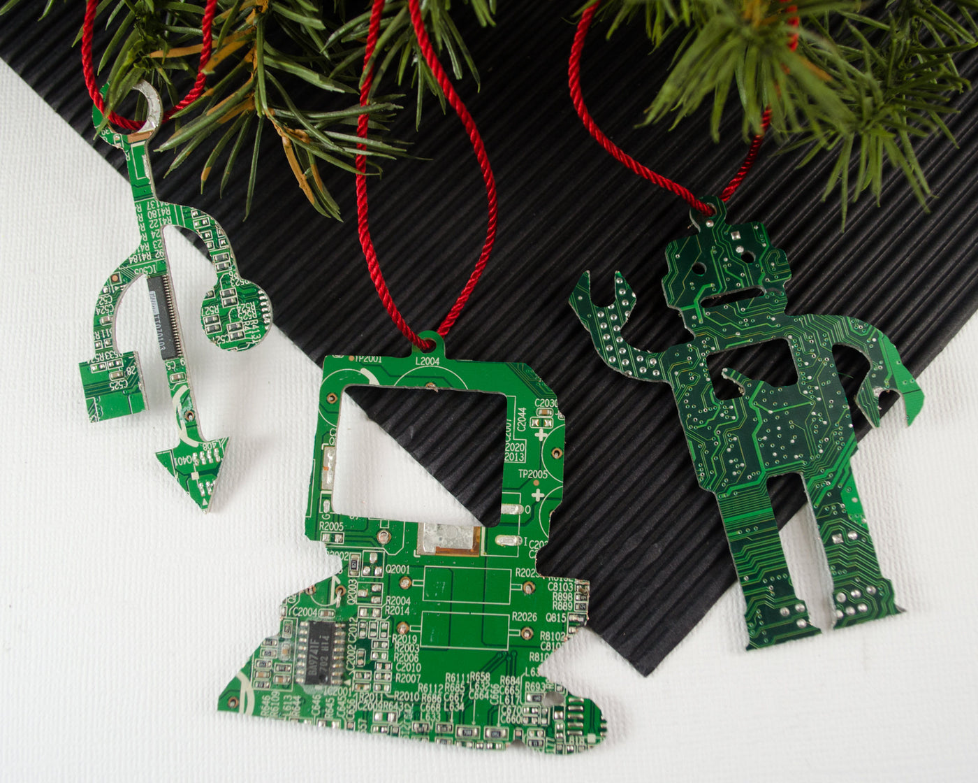 set of three green circuit board ornaments of a desktop computer, a robot, and a USB symbol for engineers