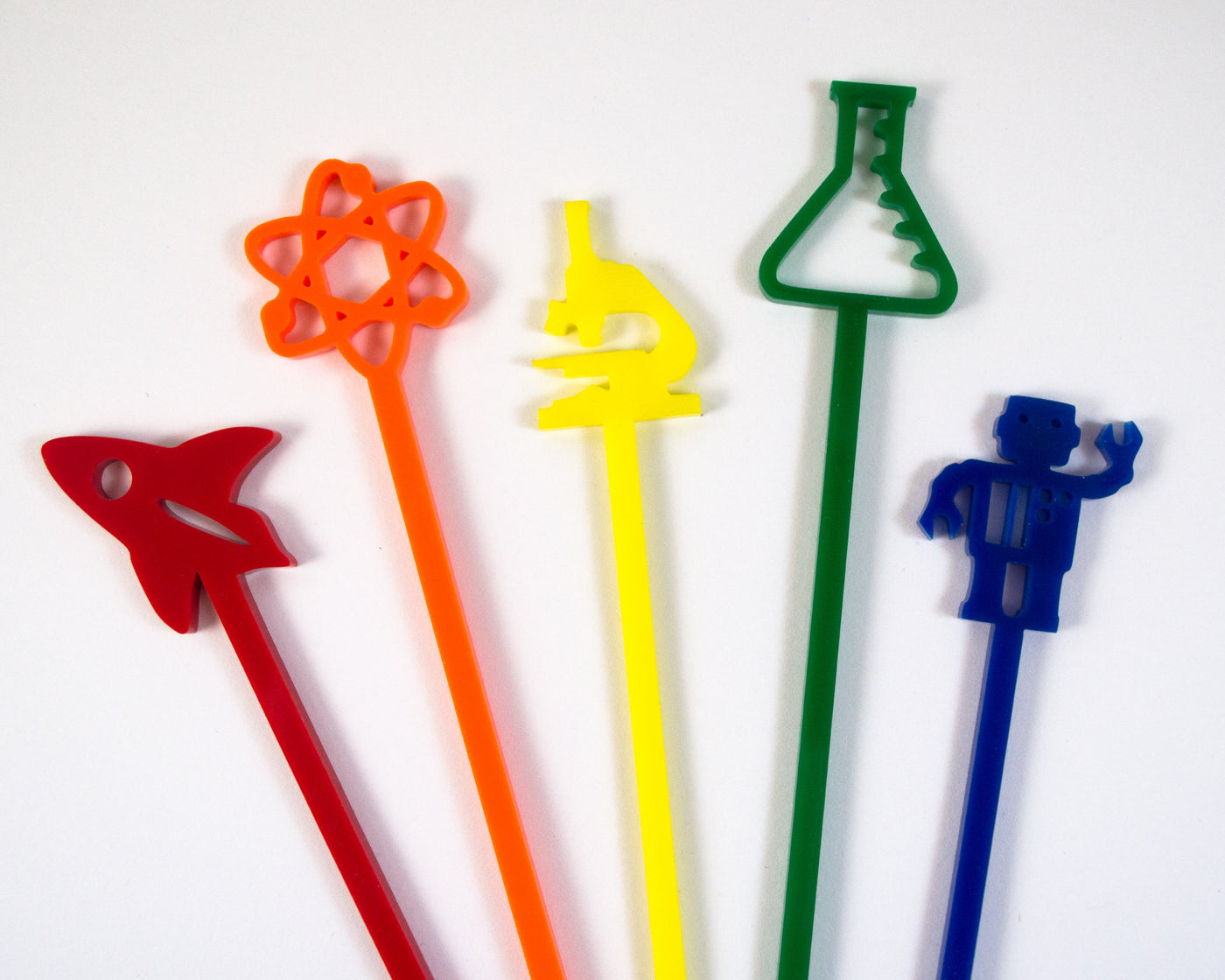 rainbow colored set of science cocktail swizzles