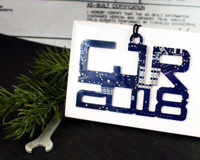 custom blue text ornament made from recycled circuit board