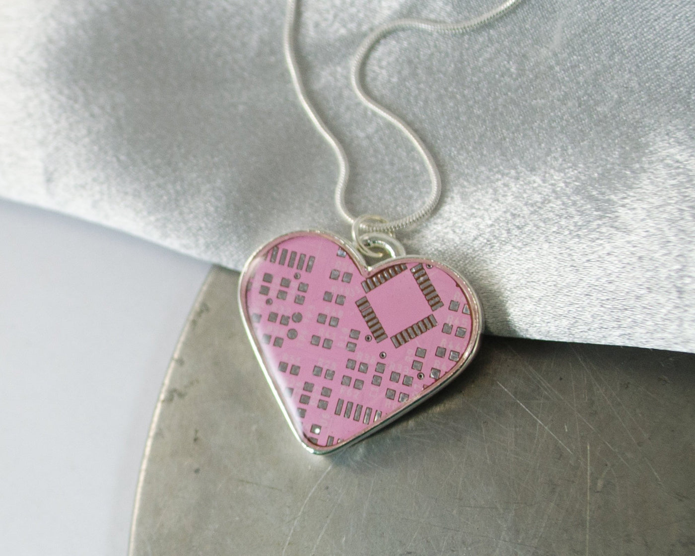 large pink circuit board heart necklace