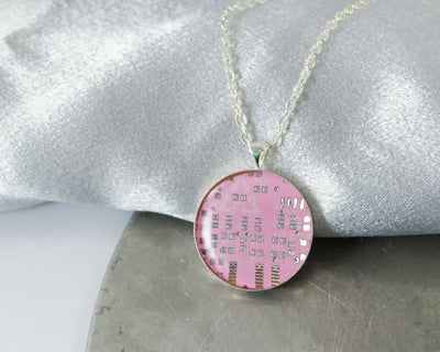 round pink circuit board necklace