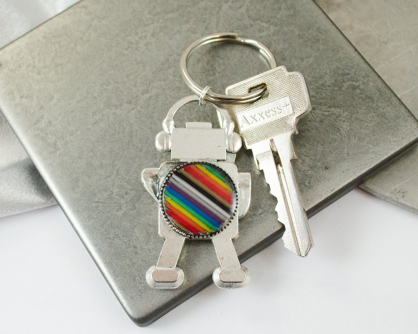 handmade rainbow robot keychain made from upcycled electronics