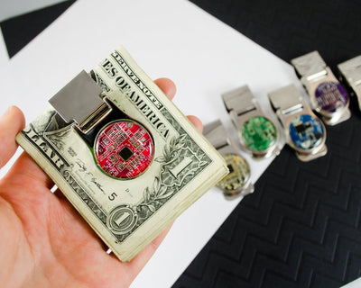 handmade red circuit board money clip in hand