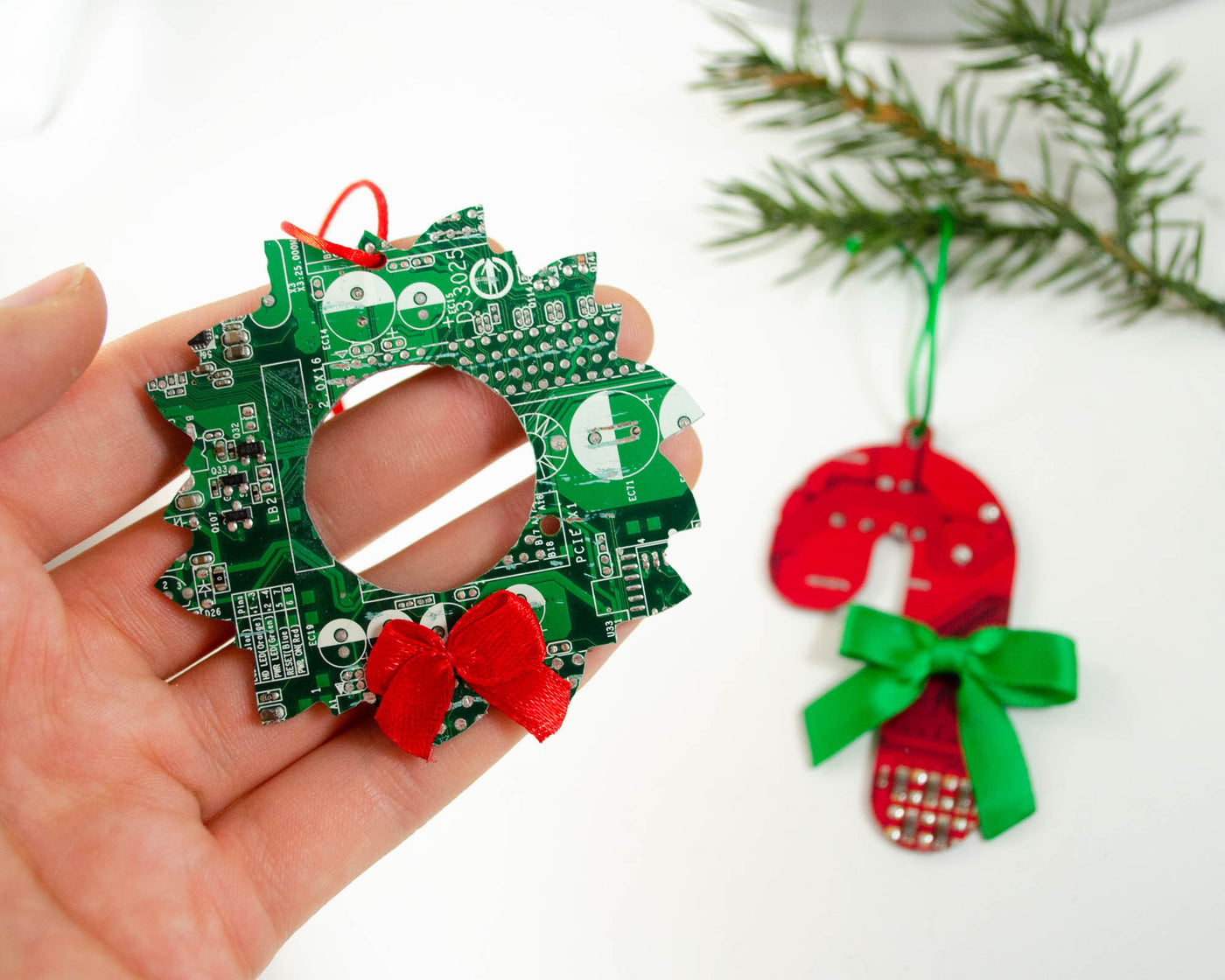 candy cane and wreath ornaments handmade from broken electronics 