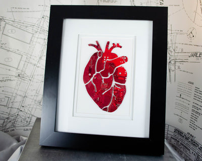 large art piece of anatomical heart made from recycled circuit boards