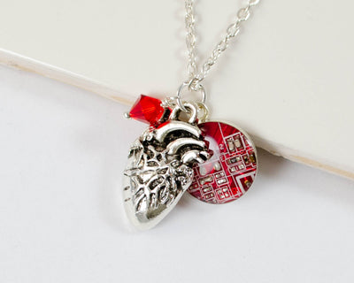 anatomical and red circuit board charm cluster necklace