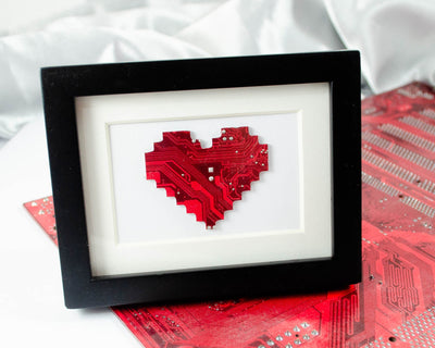 handmade art piece of a pixelated heart made from recycled circuit board