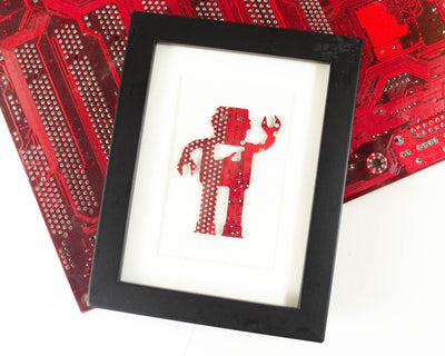 robot made from recycled red circuit board in black frame