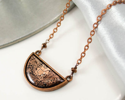 handmade copper recycled circuit board necklace in semicircle shape with faceted copper glass beads and copper chain
