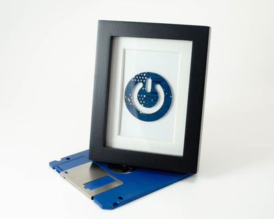 handmade framed art made from recycled circuit boards shaped into a power button