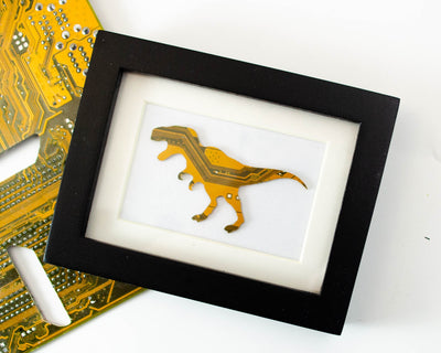 handmade framed art made from recycled circuit boards shaped like a trex
