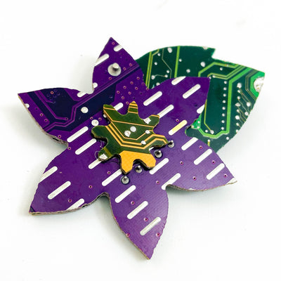 clematis brooch made from purple yellow and green recycled circuit boards