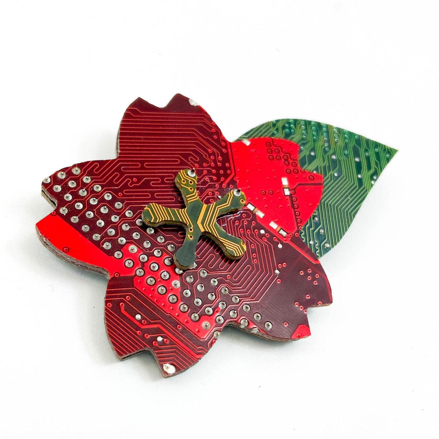 cherry blossom pin handmade from red yellow and green recycled circuit boards