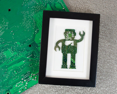 handmade framed robot art made from recycled green circuit board