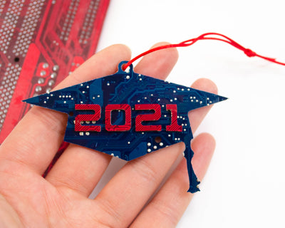 handmade graduation cap ornament made from recycled circuit board with 2021 written out in circuit baord shaped numbers
