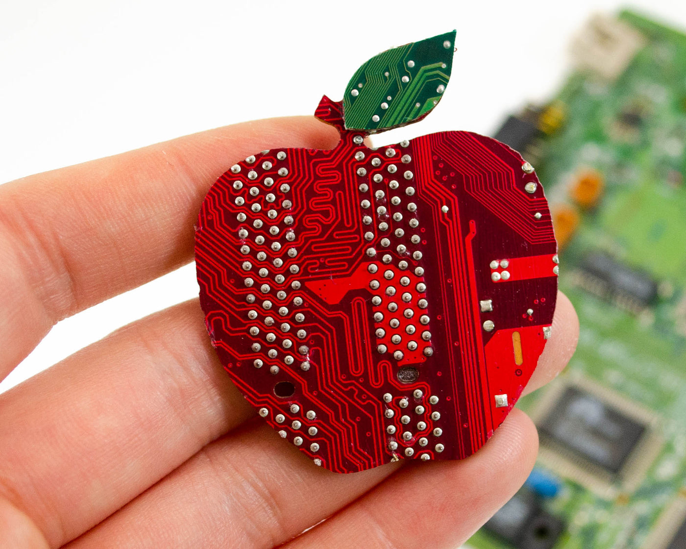 handmade apple brooch made from red and green recycled circuit boards