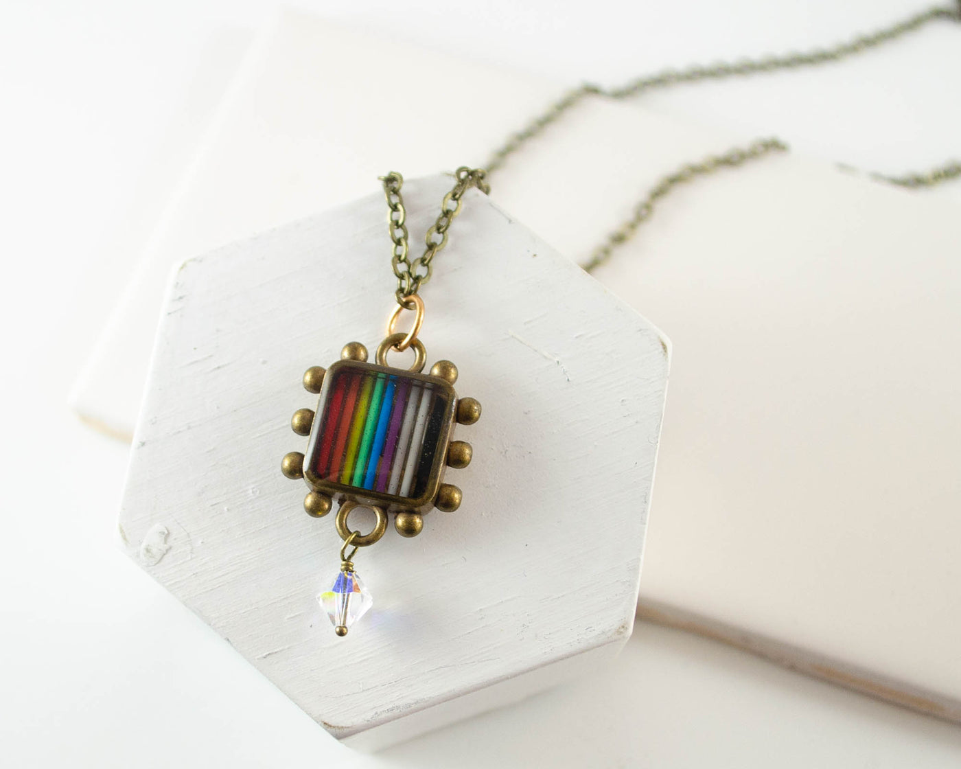 handmade necklace made from upcycled electronic parts and set in resin
