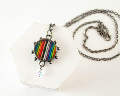 handmade rainbow ribbon cable necklace for pride and set in resin
