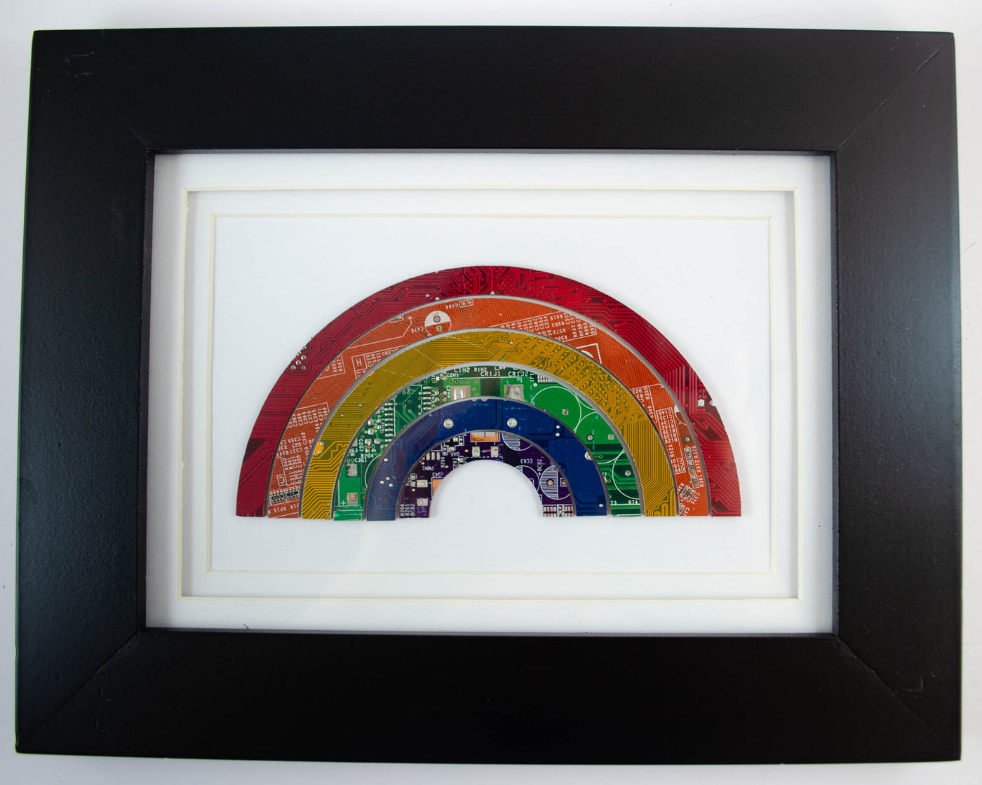 handmade framed art piece made from recycled circuit boards and made into a rainbow
